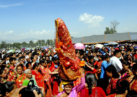 A woman carrying Gaura Devi on her head during a function organised to mark Gaura Parva in Tundikhel, Kathmandu on Saturday. Photo: THT